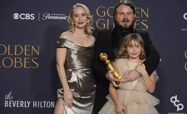 Mona Fastvold, from left, Ada Corbet, and Brady Corbet, winner of the award for best director - motion picture for "The Brutalist", pose in the press room during the 82nd Golden Globes on Sunday, Jan. 5, 2025, at the Beverly Hilton in Beverly Hills, Calif. (AP Photo/Chris Pizzello)