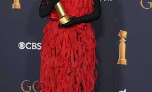 Ali Wong poses in the press room with the award for best performance in stand-up comedy on television for "Ali Wong: Single Lady" during the 82nd Golden Globes on Sunday, Jan. 5, 2025, at the Beverly Hilton in Beverly Hills, Calif. (AP Photo/Chris Pizzello)