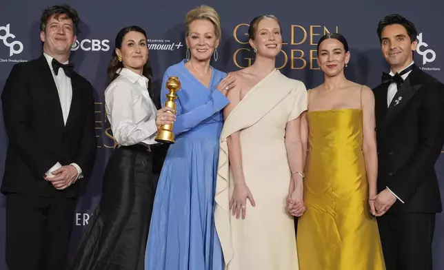 Adam Bricker, from left, Jen Statsky, Jean Smart, Hannah Einbinder, Lucia Aniello, and Paul W. Downs pose in the press room with the award for best television series - musical or comedy for "Hacks" during the 82nd Golden Globes on Sunday, Jan. 5, 2025, at the Beverly Hilton in Beverly Hills, Calif. (AP Photo/Chris Pizzello)