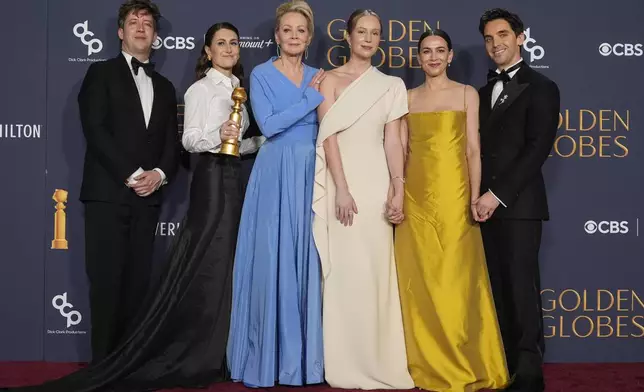 Adam Bricker, from left, Jen Statsky, Jean Smart, Hannah Einbinder, Lucia Aniello, and Paul W. Downs pose in the press room with the award for best television series - musical or comedy for "Hacks" during the 82nd Golden Globes on Sunday, Jan. 5, 2025, at the Beverly Hilton in Beverly Hills, Calif. (AP Photo/Chris Pizzello)