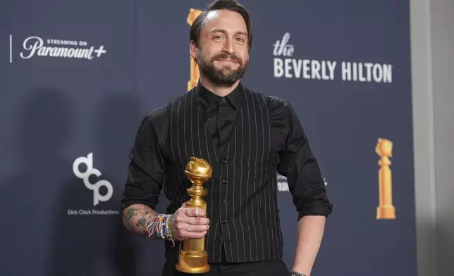 Kieran Culkin poses in the press room with the award for best performance by an actor in a supporting role in any motion picture for "A Real Pain" during the 82nd Golden Globes on Sunday, Jan. 5, 2025, at the Beverly Hilton in Beverly Hills, Calif. (AP Photo/Chris Pizzello)