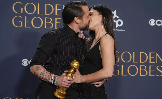 Kieran Culkin, right, winner of the award for best performance by an actor in a supporting role in any motion picture for "A Real Pain" poses with Jazz Charton during the 82nd Golden Globes on Sunday, Jan. 5, 2025, at the Beverly Hilton in Beverly Hills, Calif. (AP Photo/Chris Pizzello)