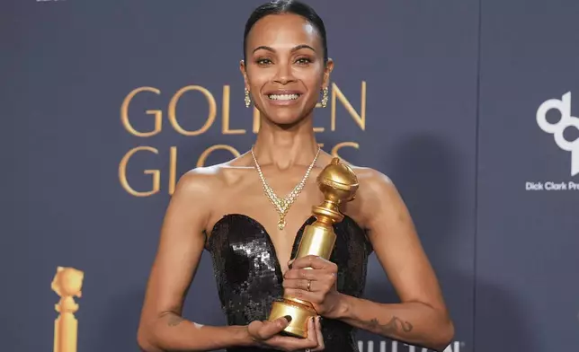 Zoe Saldana poses in the press room with the award for best performance by a female actor in a supporting role in any motion picture for "Emilia Perez" during the 82nd Golden Globes on Sunday, Jan. 5, 2025, at the Beverly Hilton in Beverly Hills, Calif. (AP Photo/Chris Pizzello)