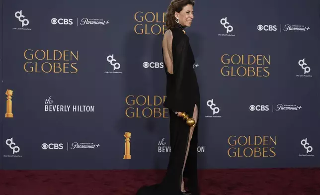 Fernanda Torres poses in the press room with the award for best performance by a female actor in a motion picture - drama for "I'm Still Here" during the 82nd Golden Globes on Sunday, Jan. 5, 2025, at the Beverly Hilton in Beverly Hills, Calif. (AP Photo/Chris Pizzello)