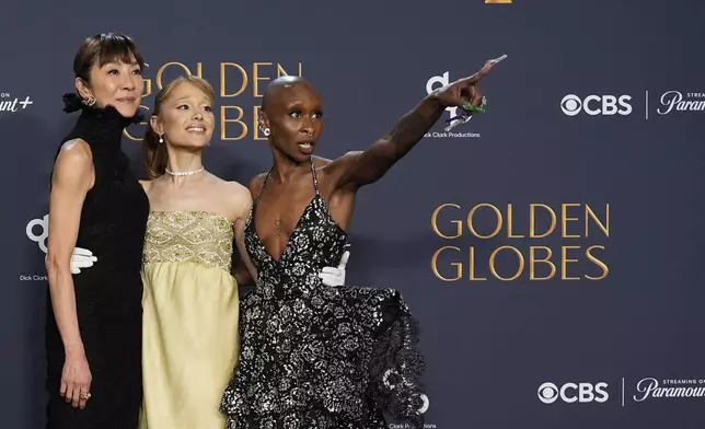 Michelle Yeoh, from left, Ariana Grande, and Cynthia Erivo pose in the press room during the 82nd Golden Globes on Sunday, Jan. 5, 2025, at the Beverly Hilton in Beverly Hills, Calif. (AP Photo/Chris Pizzello)