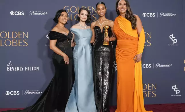 Adriana Paz, from left, Selena Gomez, Zoe Saldana, winner of the award for best performance by a female actor in a supporting role in any motion picture for "Emilia Perez," and Karla Sofia Gascon pose in the press room during the 82nd Golden Globes on Sunday, Jan. 5, 2025, at the Beverly Hilton in Beverly Hills, Calif. (AP Photo/Chris Pizzello)