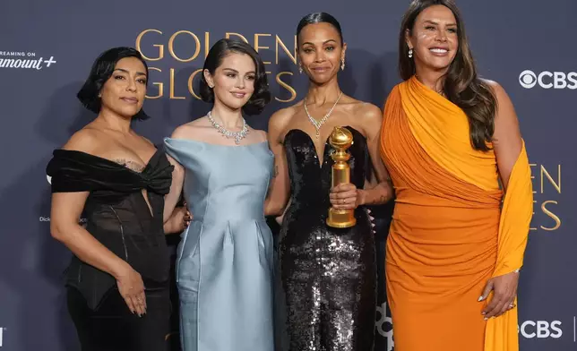 Adriana Paz, from left, Selena Gomez, Zoe Saldana, winner of the award for best performance by a female actor in a supporting role in any motion picture for "Emilia Perez," and Karla Sofia Gascon pose in the press room during the 82nd Golden Globes on Sunday, Jan. 5, 2025, at the Beverly Hilton in Beverly Hills, Calif. (AP Photo/Chris Pizzello)