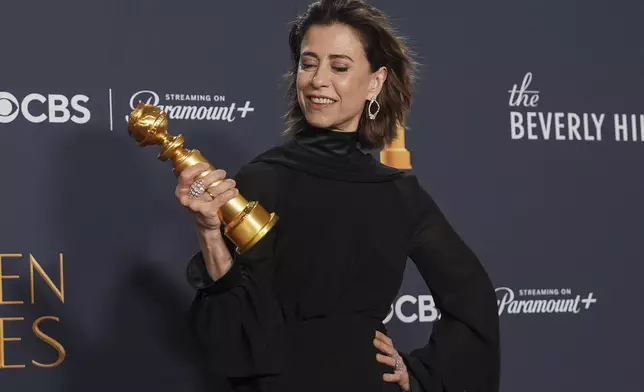 Fernanda Torres poses in the press room with the award for best performance by a female actor in a motion picture - drama for "I'm Still Here" during the 82nd Golden Globes on Sunday, Jan. 5, 2025, at the Beverly Hilton in Beverly Hills, Calif. (AP Photo/Chris Pizzello)