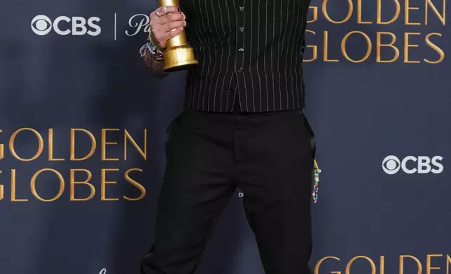 Kieran Culkin poses in the press room with the award for best performance by an actor in a supporting role in any motion picture for "A Real Pain" during the 82nd Golden Globes on Sunday, Jan. 5, 2025, at the Beverly Hilton in Beverly Hills, Calif. (AP Photo/Chris Pizzello)