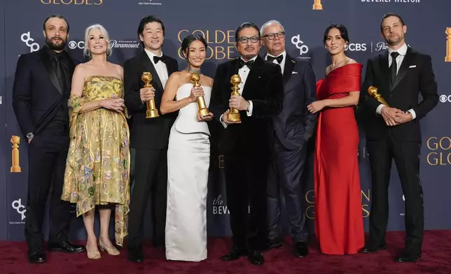 Cosmo Jarvis, from left, Michaela Clavell, Tadanobu Asano, Anna Sawai, Hiroyuki Sanada, Rachel Kondo and Justin Marks pose in the press room with the award for best television series - drama for "Shogun" during the 82nd Golden Globes on Sunday, Jan. 5, 2025, at the Beverly Hilton in Beverly Hills, Calif. (AP Photo/Chris Pizzello)