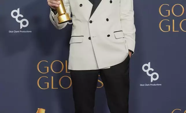 Colin Farrell poses in the press room with the award for best performance by a male actor in a limited series, anthology series, or a motion picture made for television for "The Penguin" during the 82nd Golden Globes on Sunday, Jan. 5, 2025, at the Beverly Hilton in Beverly Hills, Calif. (AP Photo/Chris Pizzello)