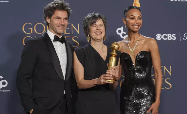 Clement Ducol Camille, left, and Camille Dalmais, center, winners of the award for best original song - motion picture for "El Mal," from "Emilia Perez" and Zoe Saldana, winner of the award for best performance by a female actor in a supporting role in any motion picture for "Emilia Perez" pose in the press room during the 82nd Golden Globes on Sunday, Jan. 5, 2025, at the Beverly Hilton in Beverly Hills, Calif. (AP Photo/Chris Pizzello)