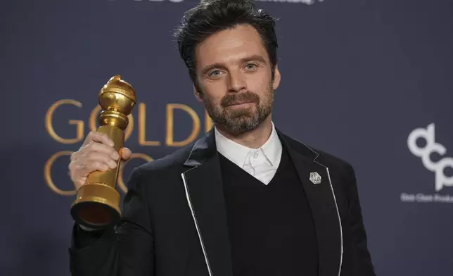 Sebastian Stan poses in the press room with the award for best performance by a male actor in a motion picture - musical or comedy for "A Different Man" during the 82nd Golden Globes on Sunday, Jan. 5, 2025, at the Beverly Hilton in Beverly Hills, Calif. (AP Photo/Chris Pizzello)