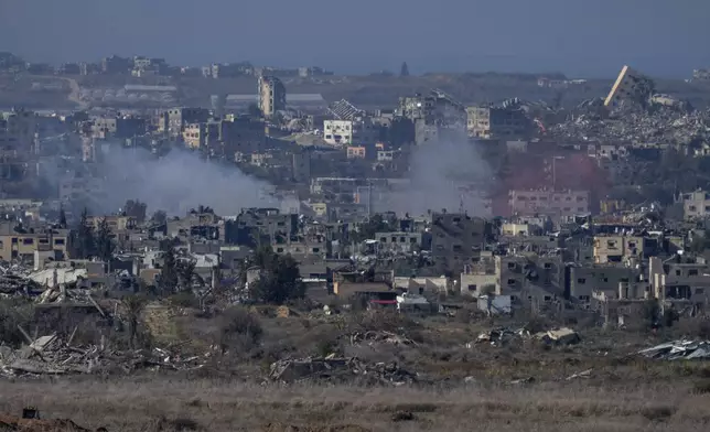 Smoke rises following an explosion in the Gaza Strip, as seen from southern Israel, Wednesday, Jan. 1, 2025. (AP Photo/Ohad Zwigenberg)