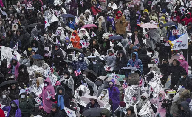 Supporters of impeached South Korean President Yoon Suk Yeol shout slogans during a rally to oppose his impeachment near the presidential residence in Seoul, South Korea, Monday, Jan. 13, 2025. (AP Photo/Lee Jin-man)