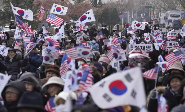 Supporters of impeached South Korean President Yoon Suk Yeol shout slogans during a rally to oppose his impeachment near the Constitutional Court in Seoul, South Korea, Tuesday, Jan. 14, 2025. (AP Photo/Lee Jin-man)