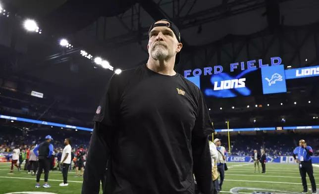 Washington Commanders head coach Dan Quinn walks on the field after an NFL football divisional playoff game against the Detroit Lions, Saturday, Jan. 18, 2025, in Detroit. (AP Photo/Rey Del Rio)