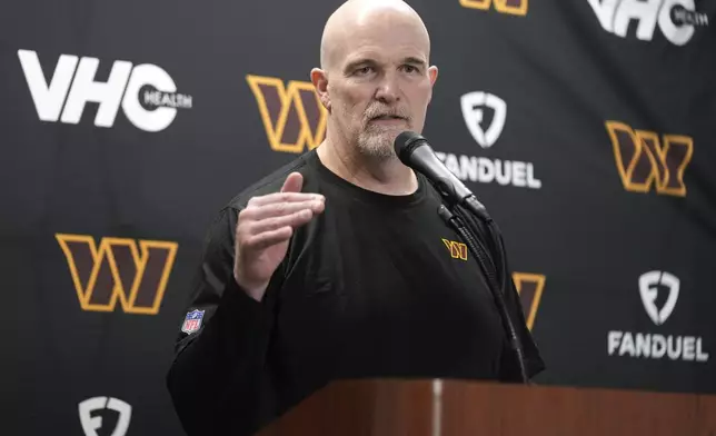 Washington Commanders head coach Dan Quinn talks to the media after an NFL football divisional playoff game against the Detroit Lions, Sunday, Jan. 19, 2025, in Detroit. (AP Photo/Seth Wenig)