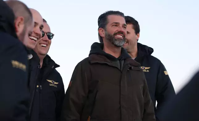 Donald Trump Jr., center, arrives in Nuuk, Greenland, Tuesday, Jan. 7, 2025. (Emil Stach/Ritzau Scanpix via AP)