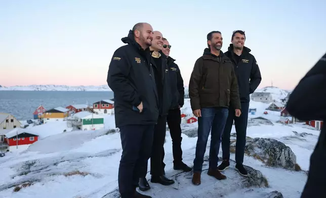 Donald Trump Jr., second right, poses for a picture upon his arrival in Nuuk, Greenland, Tuesday, Jan. 7, 2025. (Emil Stach/Ritzau Scanpix via AP)