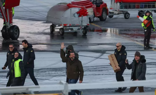 Donald Trump Jr., center, gestures as he arrives in Nuuk, Greenland, Tuesday, Jan. 7, 2025. (Emil Stach/Ritzau Scanpix via AP)