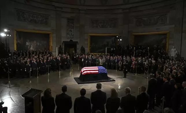 The flag-draped casket of former President Jimmy Carter lies in state during a ceremony in the Capitol, Tuesday, Jan. 7, 2025, in Washington. Carter died Dec. 29 at the age of 100. (Saul Loeb/Pool via AP)