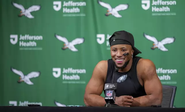 Philadelphia Eagles running back Saquon Barkley speaks to reporters following an NFL football game against the Dallas Cowboys, Sunday, Dec. 29, 2024, in Philadelphia. The Eagles won 41-7. (AP Photo/Matt Slocum)