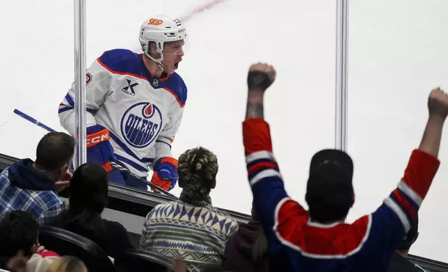 Edmonton Oilers center Jeff Skinner, top left, celebrates after scoring against the Seattle Kraken during the first period of an NHL hockey game Saturday, Jan. 4, 2025, in Seattle. (AP Photo/Lindsey Wasson)