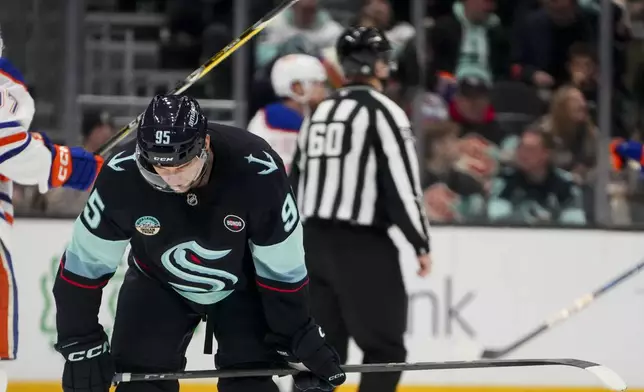 Seattle Kraken left wing Andre Burakovsky(95) reacts after a goal by the Edmonton Oilers during the second period of an NHL hockey game Saturday, Jan. 4, 2025, in Seattle. (AP Photo/Lindsey Wasson)