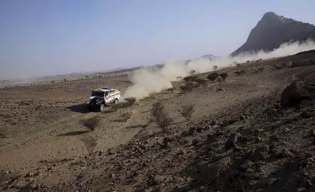 Truck driver Martin Macik, co-drivers David Svanda and Frantisek Tomasek compete during the prologue of the Dakar Rally in Bisha, Saudi Arabia, Friday, Jan. 3, 2025. (AP Photo/Christophe Ena)