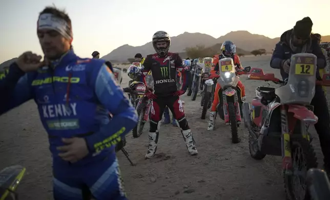 Riders prepare prior to the start of stage two, day two, of the Dakar Rally in Bisha, Saudi Arabia, Monday, Jan. 6, 2025. (AP Photo/Christophe Ena)