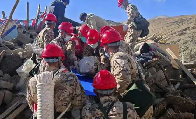 In this photo released by Xinhua News Agency, first responders perform rescue work at a village in Changsuo Township of Dingri County in Xigaze, southwest China's Tibet Autonomous Region, Jan. 7, 2025 (Hu Zikui/Xinhua via AP)