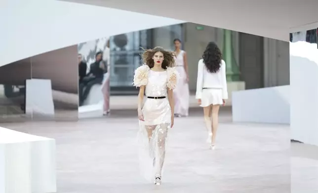 A model wears a creation as part of the Chanel Haute Couture Spring Summer 2025 collection, that was presented in Paris, Tuesday, Jan. 28, 2025. (AP Photo/Lewis Joly).
