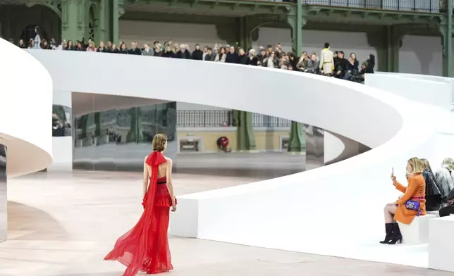 A model wears a creation as part of the Chanel Haute Couture Spring Summer 2025 collection, that was presented in Paris, Tuesday, Jan. 28, 2025. (AP Photo/Lewis Joly).