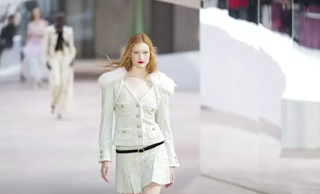 A model wears a creation as part of the Chanel Haute Couture Spring Summer 2025 collection, that was presented in Paris, Tuesday, Jan. 28, 2025. (AP Photo/Lewis Joly).