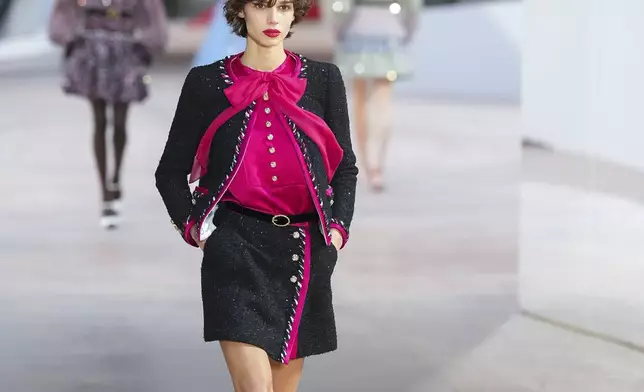 A model wears a creation as part of the Chanel Haute Couture Spring Summer 2025 collection, that was presented in Paris, Tuesday, Jan. 28, 2025. (AP Photo/Lewis Joly).