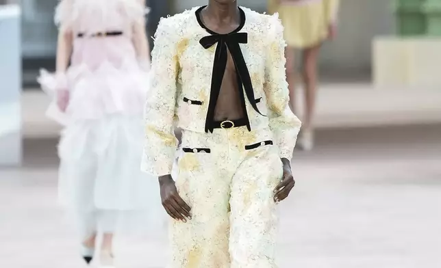 A model wears a creation as part of the Chanel Haute Couture Spring Summer 2025 collection, that was presented in Paris, Tuesday, Jan. 28, 2025. (AP Photo/Lewis Joly).