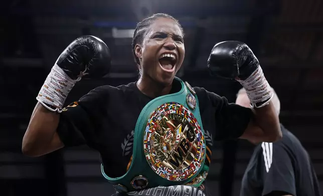Boxer Caroline Dubois celebrates after the WBC World Lightweight Championship contest against Jessica Camara at the Canon Medical Arena, Sheffield, England, Saturday, Jan. 11, 2025. (Richard Sellers/PA via AP)