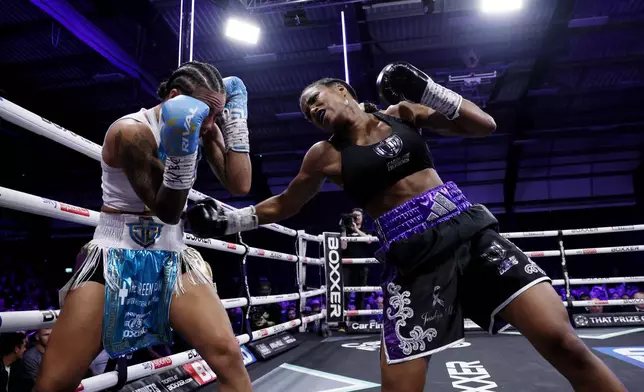 Caroline Dubois, right, punches and Jessica Camara during a WBC world lightweight championship boxing match at the Canon Medical Arena, Sheffield, England, Saturday, Jan. 11, 2025. (Richard Sellers/PA via AP)
