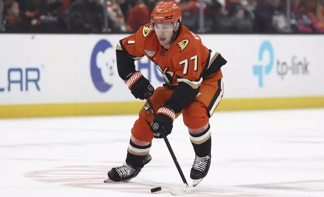 Anaheim Ducks right wing Frank Vatrano (77) controls the puck against the Philadelphia Flyers during the third period of an NHL hockey game Saturday, Dec. 28, 2024, in Anaheim, Calif. (AP Photo/Raul Romero Jr.)