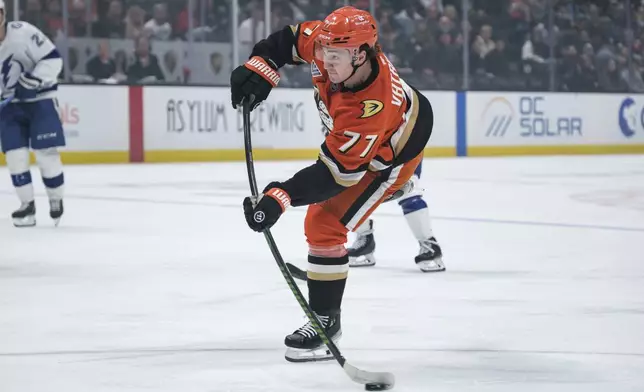 Anaheim Ducks right wing Frank Vatrano (77) shoots the puck during the first period of an NHL hockey game against the Tampa Bay Lightning, Sunday, Jan. 5, 2025, in Anaheim, Calif. (AP Photo/William Liang)