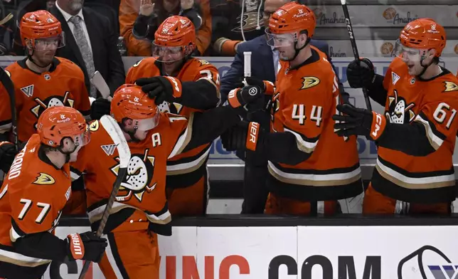 Anaheim Ducks center Ryan Strome, third from left, celebrates scoring against the Edmonton Oilers with right wing Frank Vatrano (77) and center Jansen Harkins (38) during the third period of an NHL hockey game in Anaheim, Calif., Sunday, Dec. 29, 2024. (AP Photo/Alex Gallardo)