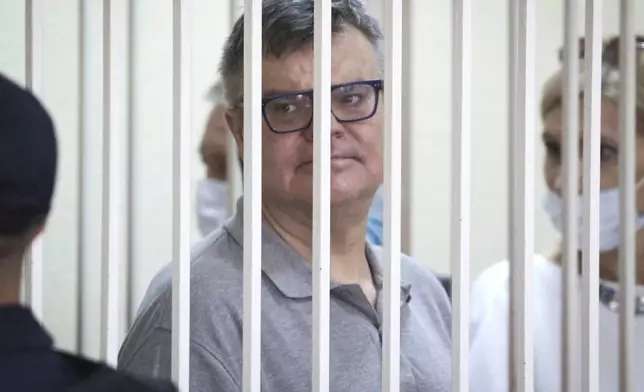 FILE - Viktar Babaryka, a former presidential hopeful, stands inside a defendants’ cage during his trial in Minsk, Belarus, on July 6, 2021. (Ramil Nasibulin/BelTA Pool Photo via AP, File)