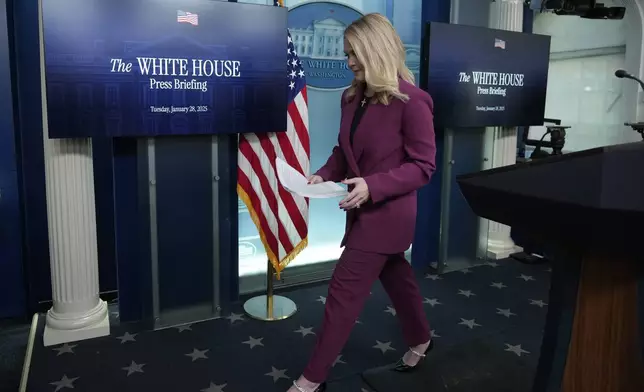 White House press secretary Karoline Leavitt walks off after speaking at the daily briefing at the White House in Washington Tuesday, Jan. 28, 2025. (AP Photo/Ben Curtis)