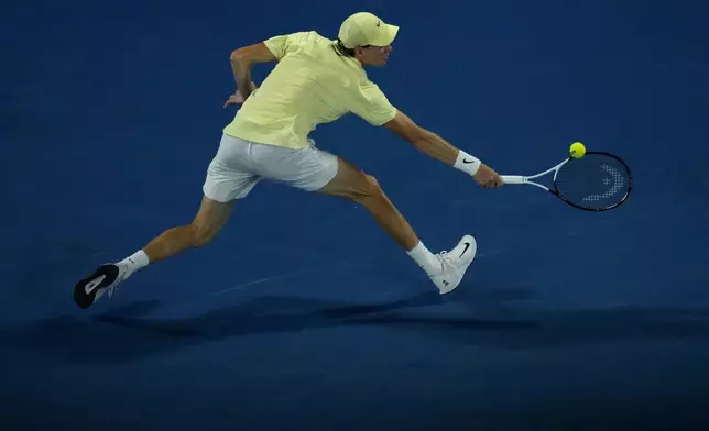 Jannik Sinner of Italy plays a backhand return to Alexander Zverev of Germany in the men's singles final at the Australian Open tennis championship in Melbourne, Australia, Sunday, Jan. 26, 2025. (AP Photo/Manish Swarup)