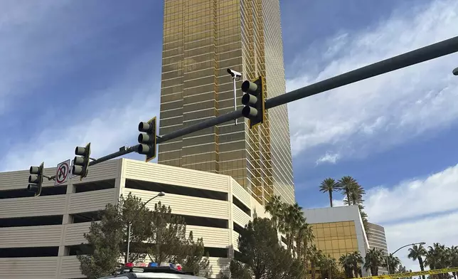 Police block the area after a vehicle caught fire and exploded outside the lobby of President-elect Donald Trump's hotel Wednesday, Jan. 1, 2025. (AP Photo/Ty ONeil)