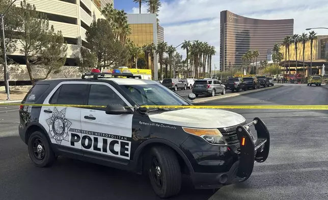 Police block the area after a vehicle caught fire and exploded outside the lobby of President-elect Donald Trump's hotel Wednesday, Jan. 1, 2025. (AP Photo/Ty ONeil)