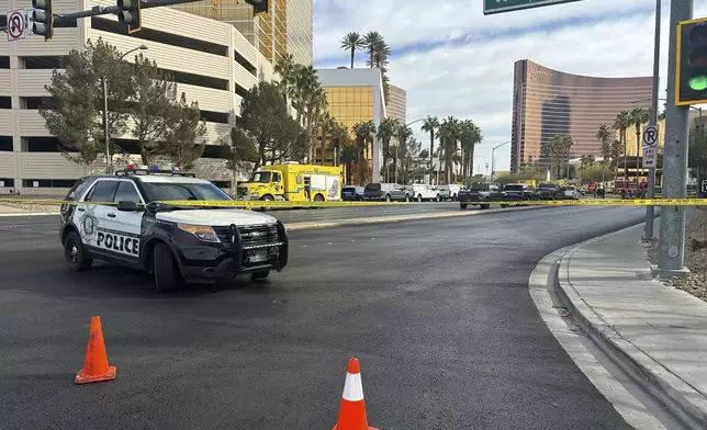 Police block the area after a vehicle caught fire and exploded outside the lobby of President-elect Donald Trump's hotel Wednesday, Jan. 1, 2025. (AP Photo/Ty ONeil)