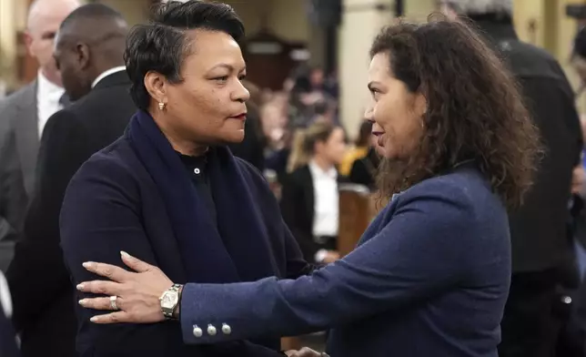 New Orleans Mayor LaToya Cantrell, left, greets city council member Lesli Harris before an interfaith prayer service for the victims of the deadly New Years truck attack, at St. Louis Cathedral in New Orleans, Monday, Jan. 6, 2025. (AP Photo/Gerald Herbert)