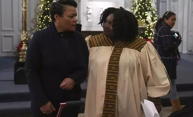 New Orleans Mayor LaToya Cantrell, left, greets choir member Renee Dolliole before an interfaith prayer service for the victims of the deadly New Years truck attack, at St. Louis Cathedral in New Orleans, Monday, Jan. 6, 2025. (AP Photo/Gerald Herbert)